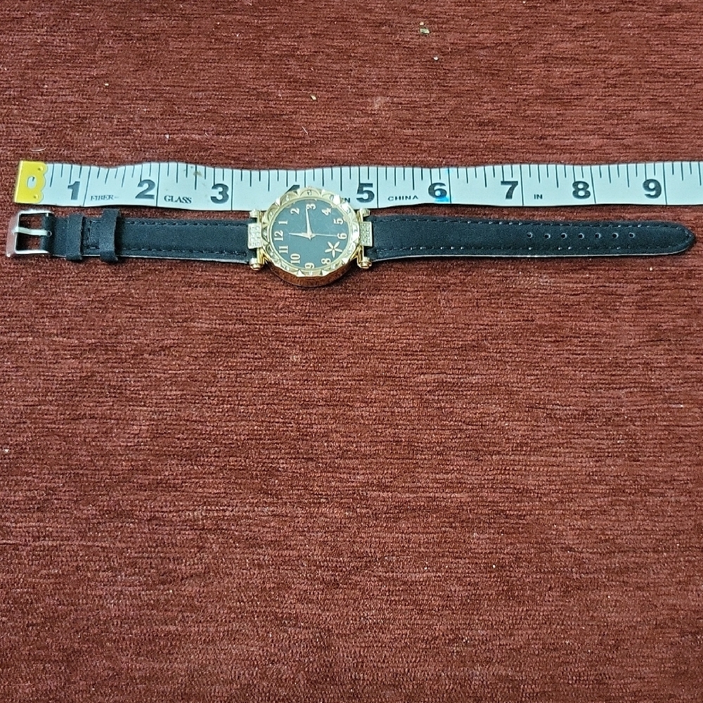 Black and Gold Watch With Big Numbers